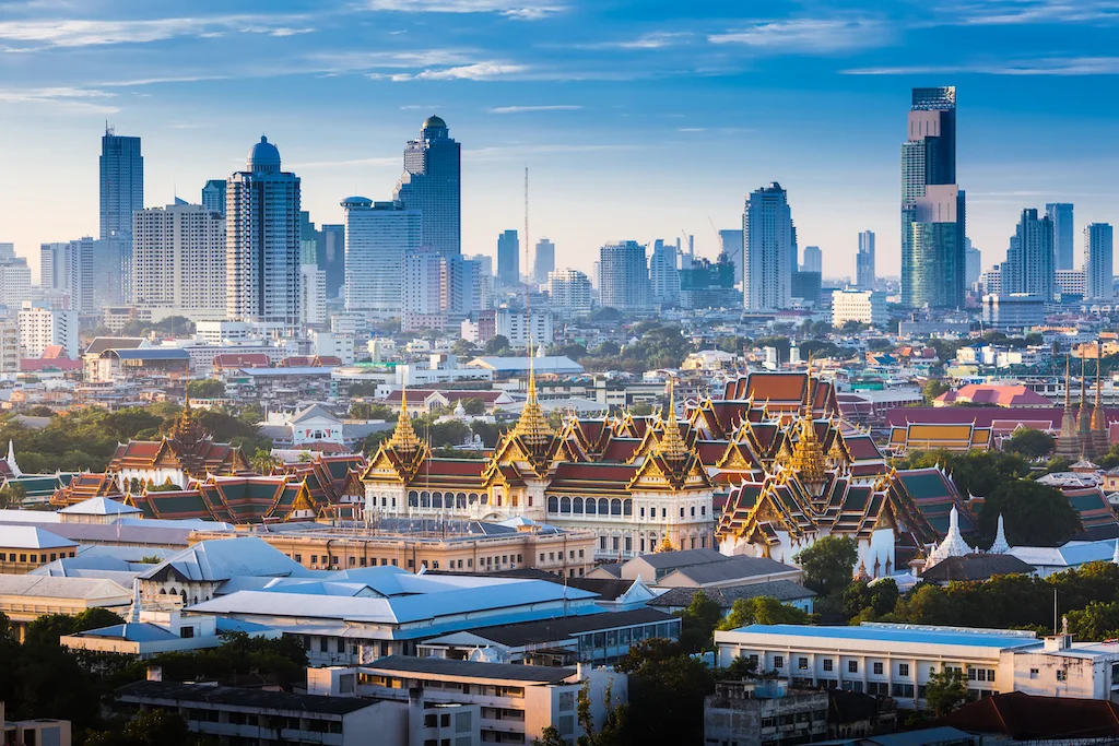 the-golden-grand-palace-of-bangkok-with-skyscraper-view-of-cityscape-at-sunrise-time-the-most